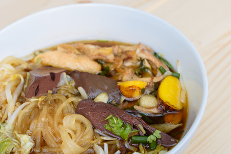 noodle soup in bowl on a wooden table, Thai local foodの写真素材