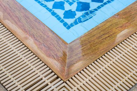 Edge of blue swimming pool outdoor