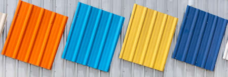 roof orange, blue, yellow, cyan, white backgroundの写真素材