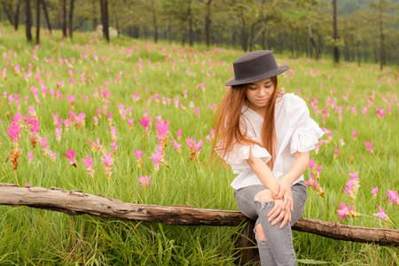 portrait of a woman relaxing in the garden siam tulipの写真素材