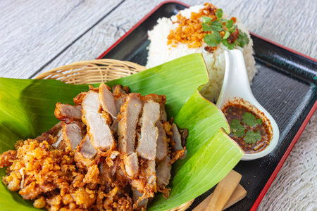 fry pork with sticky rice and spicy sauce, close-upの写真素材