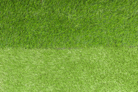 Artificial two green grass contrast floor detail and texture background or backdrop.の写真素材