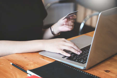 Online payment with Young Women using computer and credit card for online shoppingの写真素材