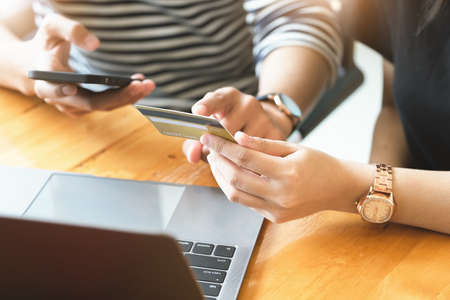 Give preference to female use credit cards while talking to men who are using smartphone and...