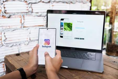 CHIANGMAI, THAILAND - June 06, 2021: A woman holding smartphone with Instagram application on the screen. Instagram is a photo sharing app for smartphonesのeditorial素材