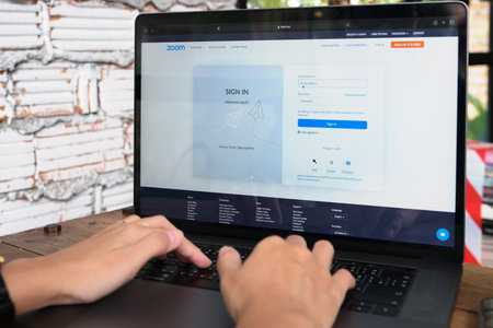 CHIANGMAI, THAILAND - JUNE 06, 2021: Person using computer laptop to login zoom on screen, Zoom Video Communications applicationのeditorial素材