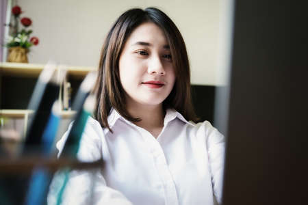 freelance concept,female using computers to design work as ordered by customers at home.の写真素材