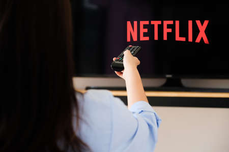Chiang mai Thailand, 2020 June 07 - A young woman watches Netflix on his TV and at home.のeditorial素材