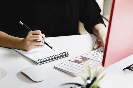 Work from home Company employees use their notebook and computers to work from home.の写真素材