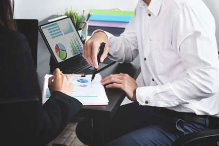 Two young business executives are discussing to change their business concept to increase profits...