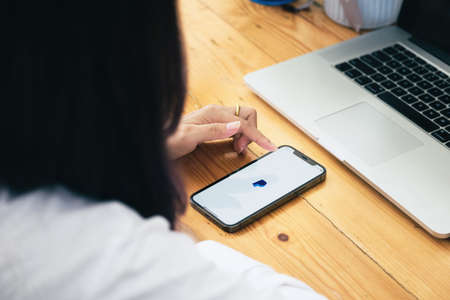 CHIANG MAI, THAILAND - MAY 30, 2021 : Women hands holding Oneplus 6 with PayPal apps on the screen. PayPal is an online electronic payment system.のeditorial素材