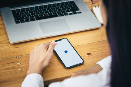 CHIANG MAI, THAILAND - MAY 30, 2021 : Women hands holding Oneplus 6 with PayPal apps on the screen. PayPal is an online electronic payment system.のeditorial素材