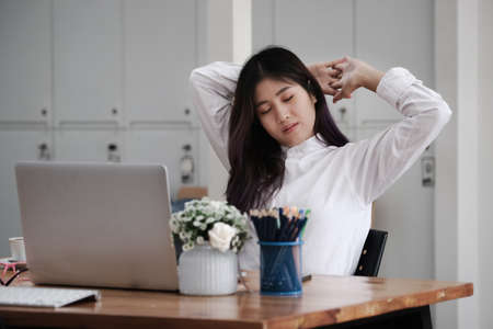 Employees show signs of boredom from working full time.の写真素材