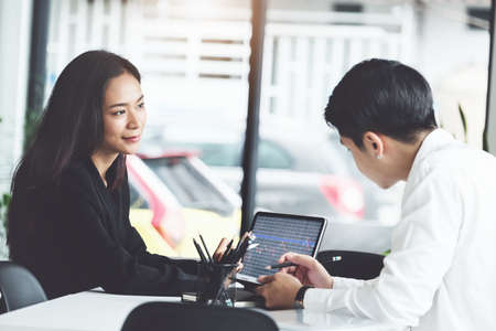Two business executives are discussing to change their business concept to increase profits and the strength of their business.の写真素材