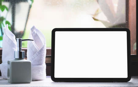 tablet for work on wood desk, a blank tablet screen can add text or other media.