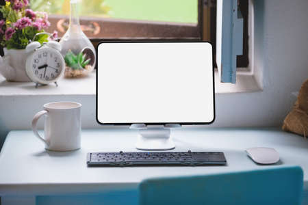 tablet for work on wood desk, a blank tablet screen can add text or other media.