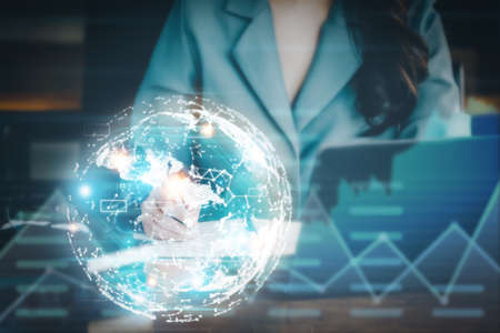 Investment concepts, businesswomen use document and computers to analyze stock markets, quantitative data collection, financial statement analysis, profitability through internet technology.の写真素材