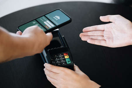 Payment security technology concept and service fees, Employees are holding electronic card machines...