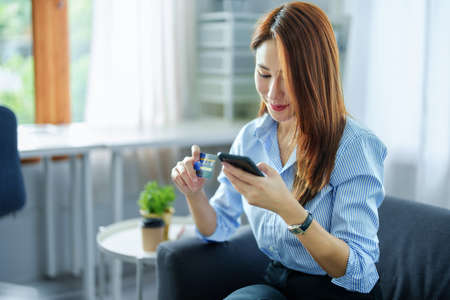 Online Shopping and Internet Payments, Portrait of Asian woman are using their credit cards and to...