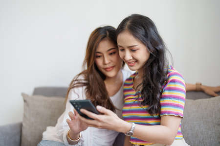 lgbtq, lgbt concept, homosexuality, portrait of two asian women enjoying together and showing love...