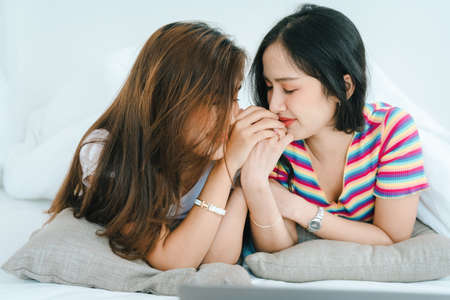 lgbtq, lgbt concept, homosexuality, portrait of two Asian women posing happy together and showing...