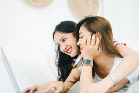 lgbtq, lgbt concept, homosexuality, portrait of two asian women posing happy together and loving...
