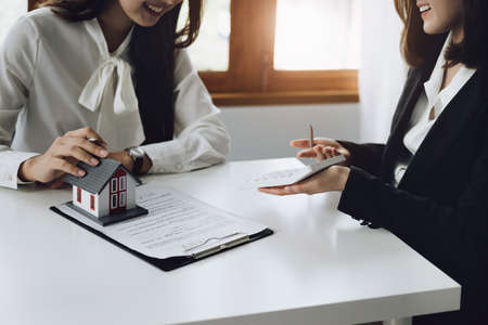 Guarantee, mortgage, contract, contract, signed, real estate agent or bank officer holding a...