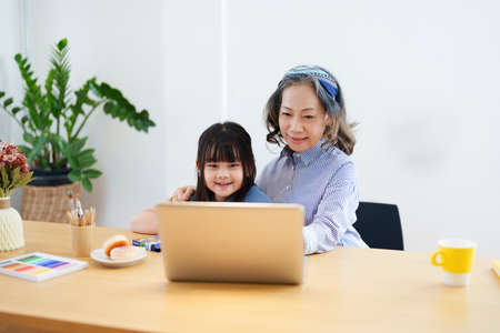 Asian portrait, grandchild granddaughter grandma grandmother and granddaughter happily join in...