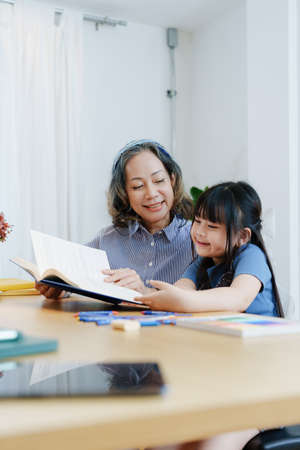 Asian portrait, grandchild granddaughter grandma grandmother and granddaughter happily join in...
