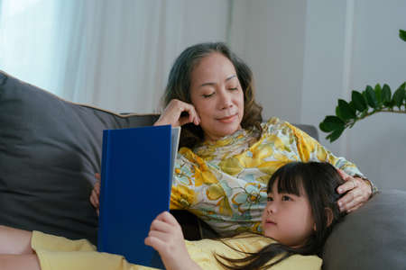 Asian portrait, grandchild granddaughter grandma grandmother and granddaughter happily join in...