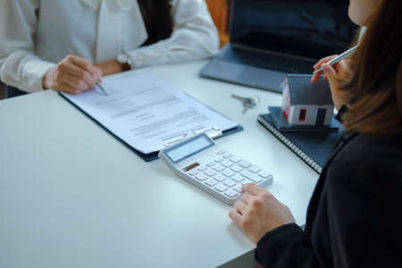 Guarantee, mortgage, contract, contract, signed, real estate agent or bank officer pointing a...