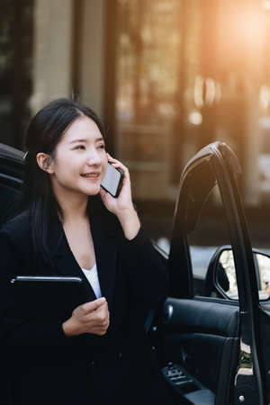 Asian businessmen, business owners, company presidents or female employees talking on the phone and...