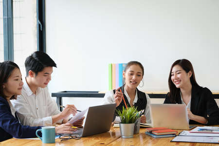 Start-up Business, a team of young entrepreneurs working together to increase profits into the company to increase business potentialの写真素材