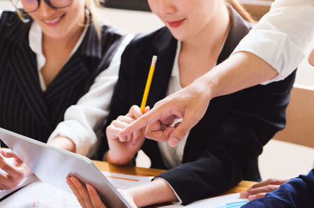 Start-up Business, a team of young entrepreneurs working together to increase profits into the...