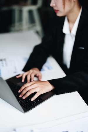 data analysis, plan, marketing, accounting, audit, Portrait of asian business woman planning marketing using computer and statistical data sheet to present marketing plan project at meetingの写真素材
