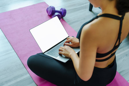 stress relief, muscle relaxation, breathing exercises, exercise, meditation, Young Asian woman relaxing her body from office work by practicing yoga by watching online tutorialsの写真素材