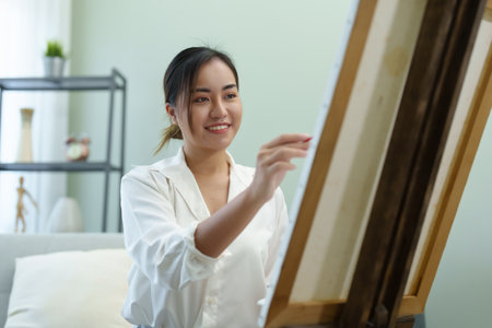 Portrait of an Asian woman designing art in her spare timeの写真素材