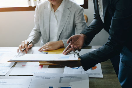 Asian entrepreneurs and business people meeting in a conference room in business planning, financial budget and investment risk assessment to analyze customer groups to increase company growth.の写真素材