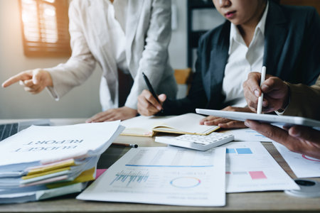 Asian entrepreneurs and business people meeting in a conference room in business planning, financial budget and investment risk assessment to analyze customer groups to increase company growth.の写真素材
