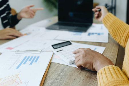 Asian entrepreneurs and business people meeting in a conference room in business planning, financial budget and investment risk assessment to analyze customer groups to increase company growth.の写真素材