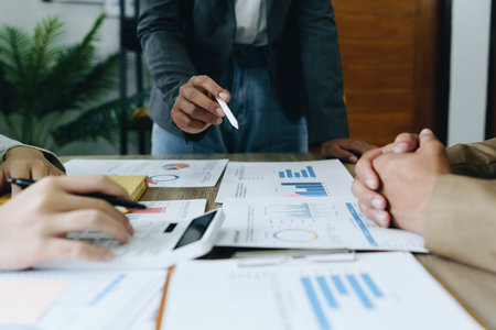 Asian entrepreneurs and business people meeting in a conference room in business planning, financial budget and investment risk assessment to analyze customer groups to increase company growth.の写真素材
