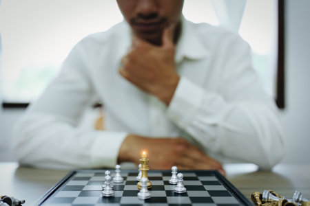 Playing and planning a chess walk, an entrepreneur is planning a business to compete with the competitors in the marketing.の写真素材