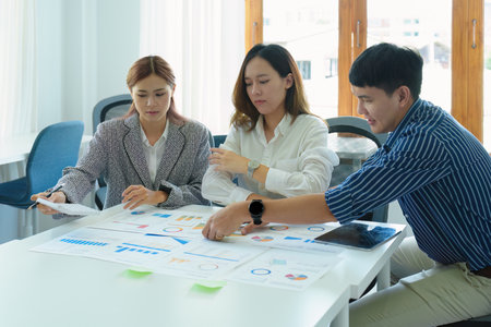 Planning to reduce investment risks, the image of a group of businesspeople working with partners is...