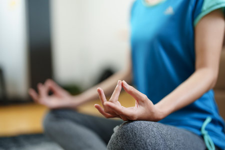 stress relief, muscle relaxation, breathing exercises, exercise, meditation, portrait of Young Asian woman relaxing her body from office work by practicing yoga by watching online tutorials.の写真素材