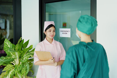 Portrait of doctor and nurse talking to prepare before going to the emergency room to treat patients.の写真素材