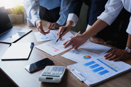 Economists give consultations to employees to increase their potential in using investment budget, planning marketing and assessing risks in investment budgets.の写真素材