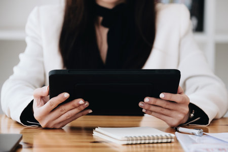 business woman using a tablet computer for data analysis, marketing, accounting.の写真素材
