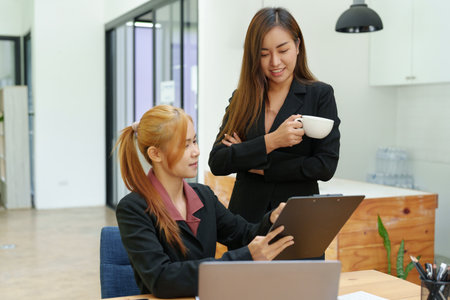 Portrait of an Asian businesswoman consulting, start up a marketing plan to meet the needs of customers in office roomの写真素材