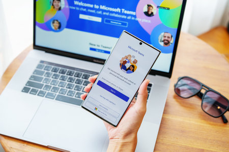 CHIANG MAI, THAILAND - Jul 09, 2022- A female employee uses a microsoft team app to hold a social media meeting.のeditorial素材