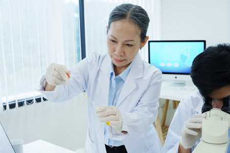 medical research laboratories, scientists analyze chemical samples Discuss technological innovations. Advanced scientific laboratories for medicine, biotechnologyの写真素材